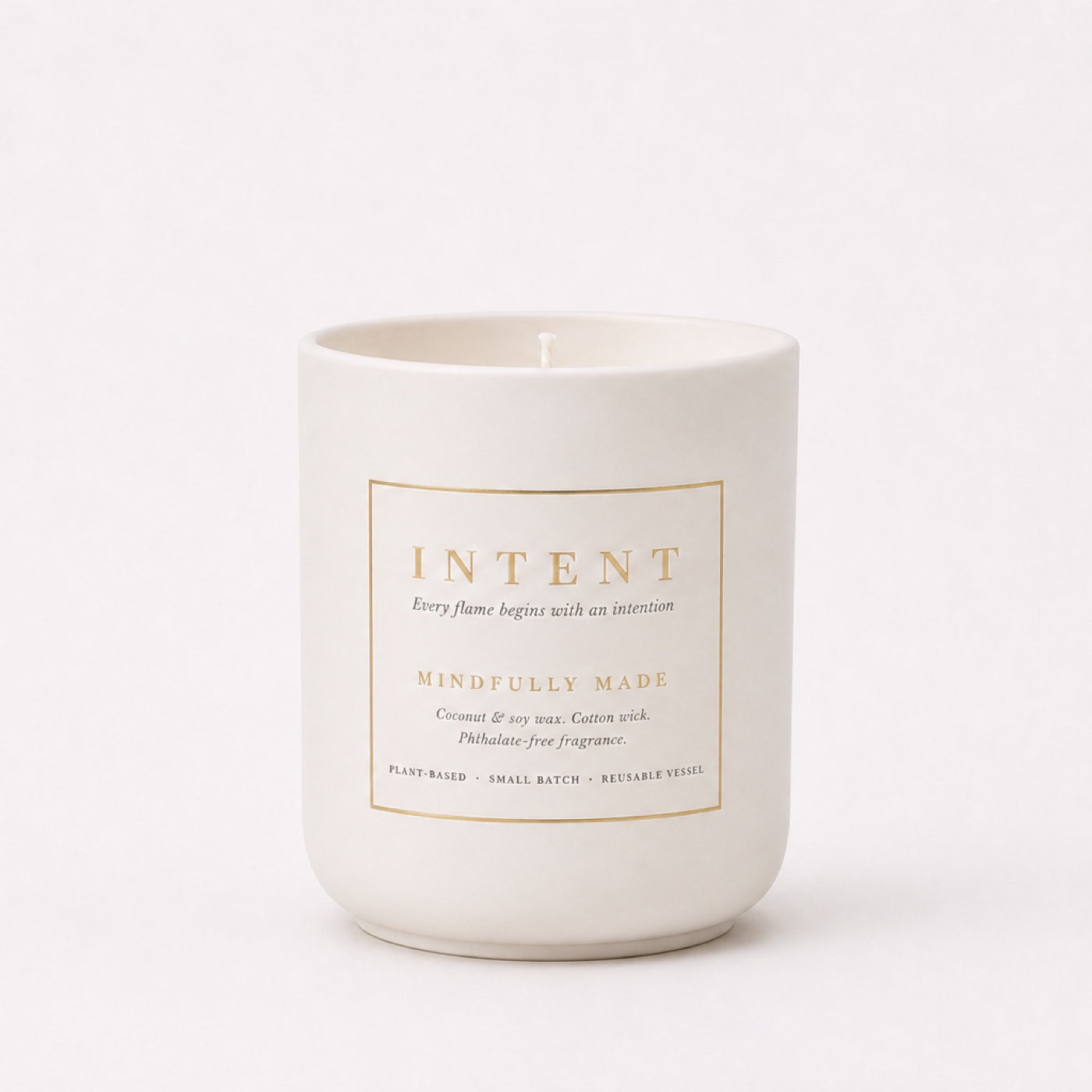 Intent Ivory soft off white ceramic candle vessel with gold label
