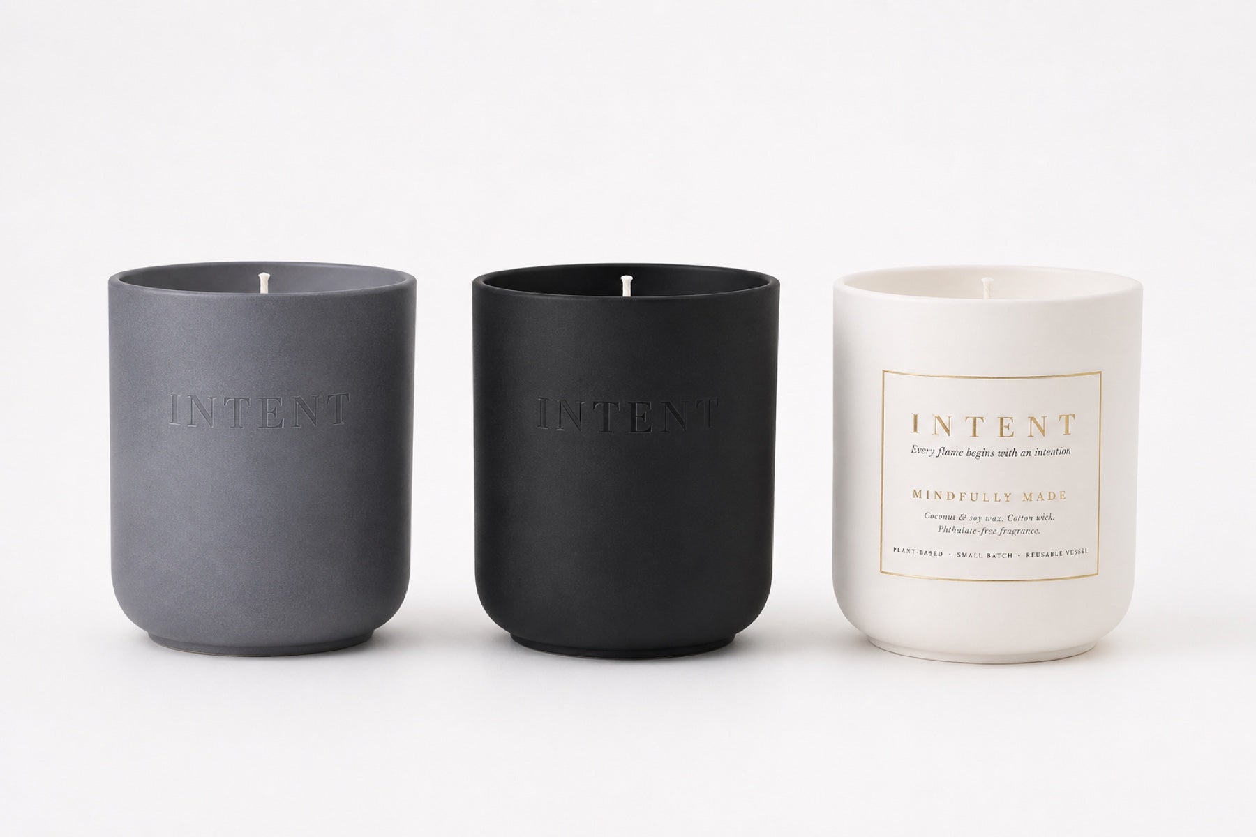 Three Intent vessels in Stone, Charcoal, and Ivory